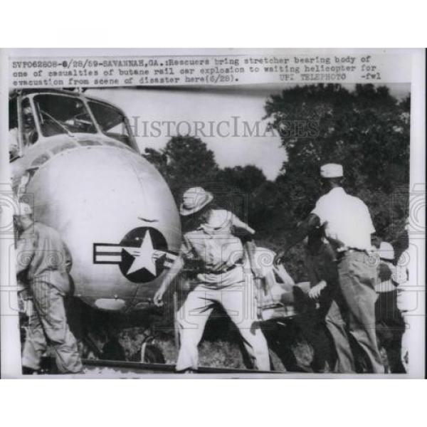 1959 Press Photo Rescuers Bring Stretcher Bearing Body From Rail Car Explosion #1 image